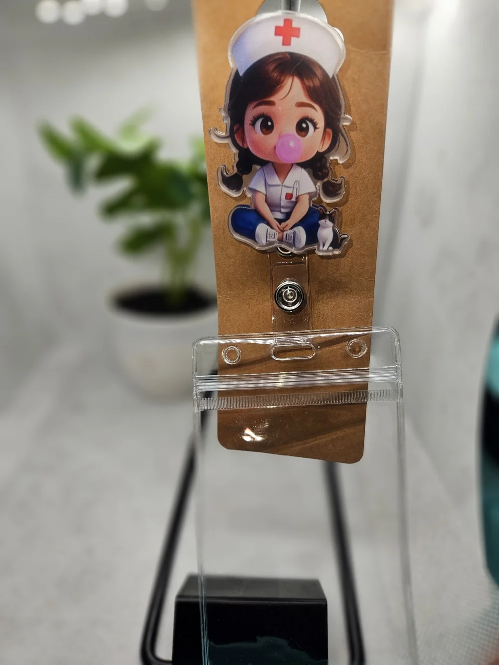 Nurse Blowing A Bubble ID Retractable Reel